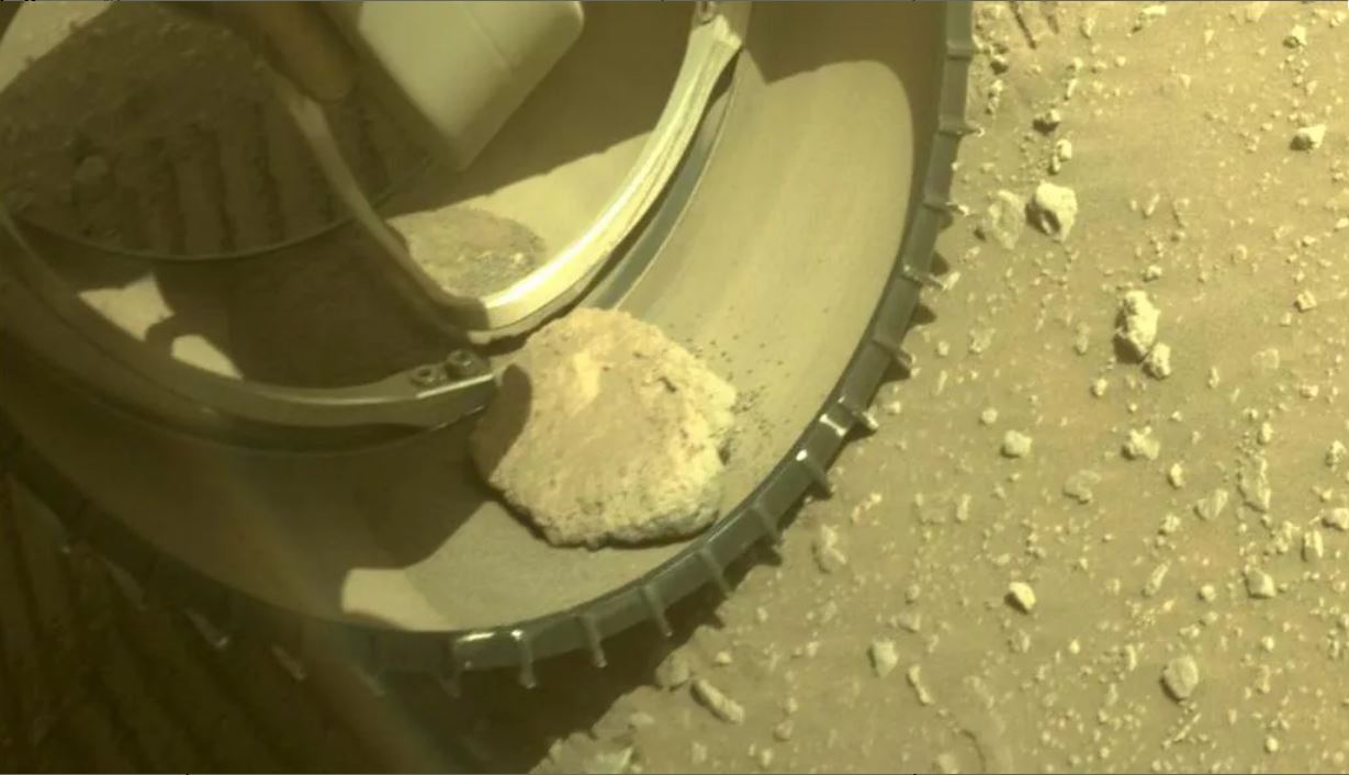 A rock has hitched a ride in one of NASA's Mars Perseverance Rover's wheels.